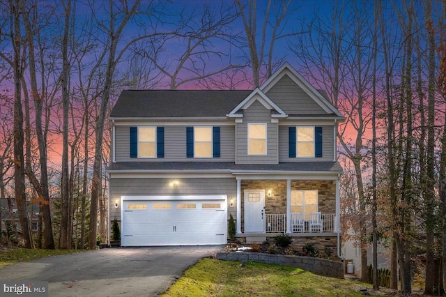 craftsman-style house with covered porch and a garage