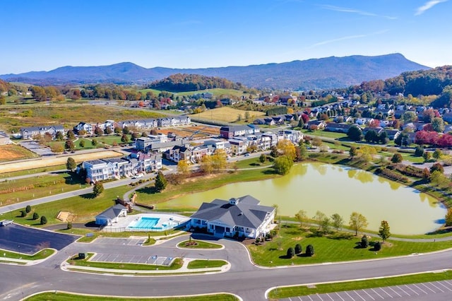 aerial view featuring a water and mountain view