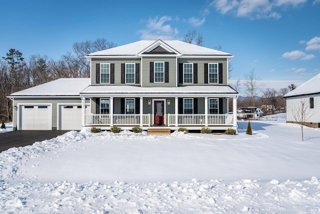 view of front of house featuring a garage and covered porch