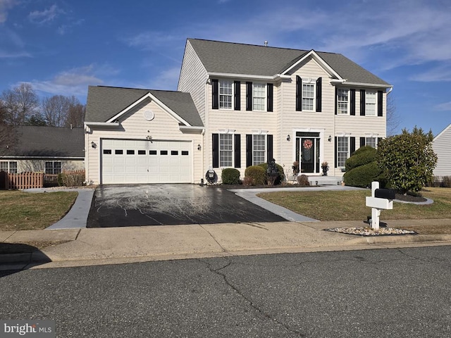 colonial-style house featuring a garage