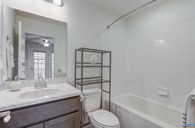 full bathroom with vanity, toilet, ceiling fan, and  shower combination