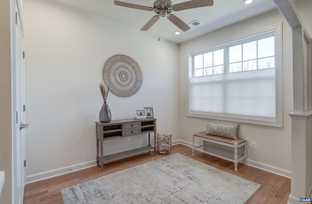 sitting room featuring light hardwood / wood-style flooring and ceiling fan