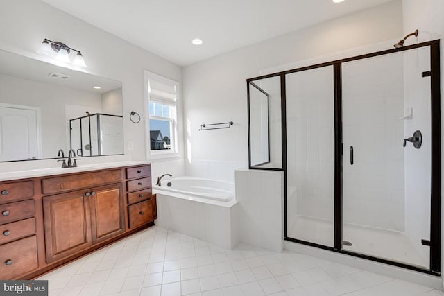 bathroom featuring a garden tub, tile patterned flooring, a shower stall, vanity, and recessed lighting