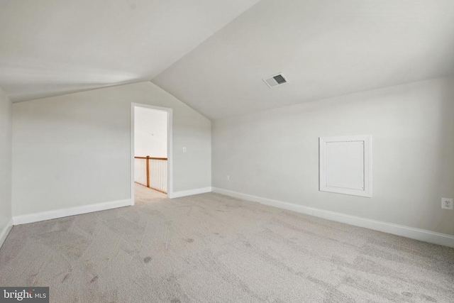 bonus room with baseboards, visible vents, carpet, and lofted ceiling