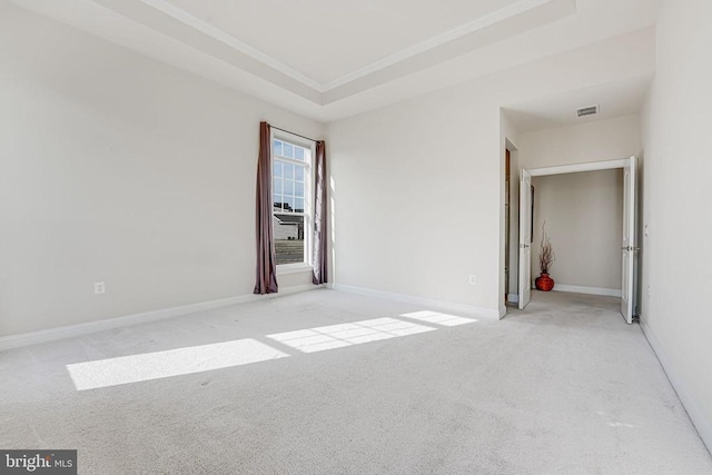 unfurnished bedroom featuring visible vents, ornamental molding, carpet, and baseboards