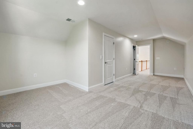 bonus room with recessed lighting, baseboards, vaulted ceiling, and light carpet