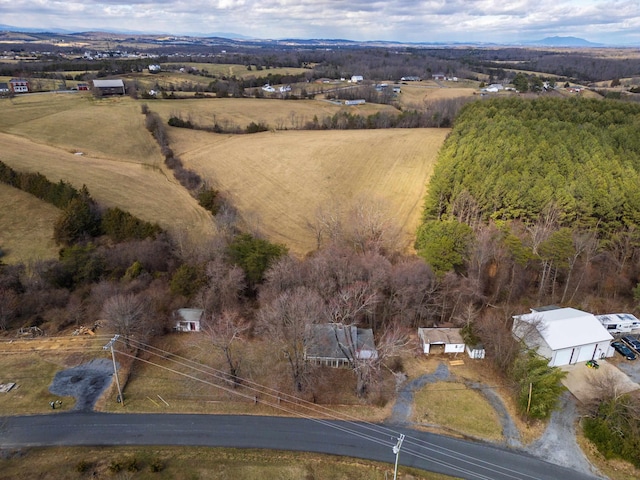 birds eye view of property with a rural view