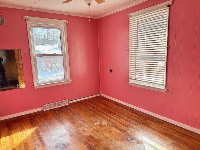 unfurnished room featuring crown molding, ceiling fan, and hardwood / wood-style flooring