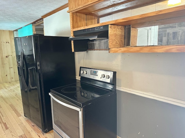 kitchen featuring electric stove, black fridge with ice dispenser, light hardwood / wood-style floors, and a textured ceiling