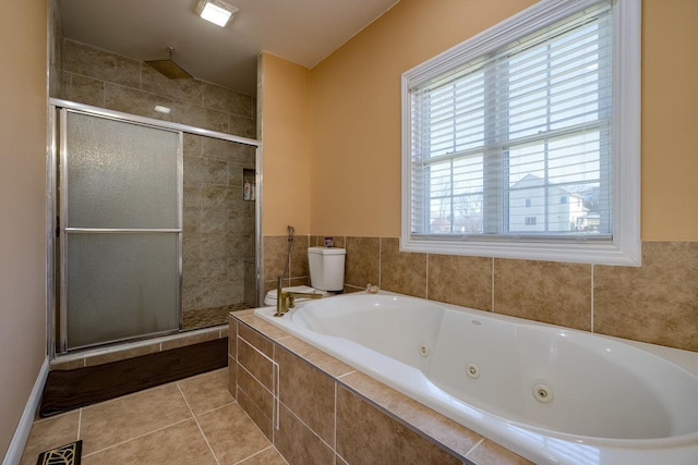 full bathroom featuring a stall shower, visible vents, a whirlpool tub, and tile patterned floors