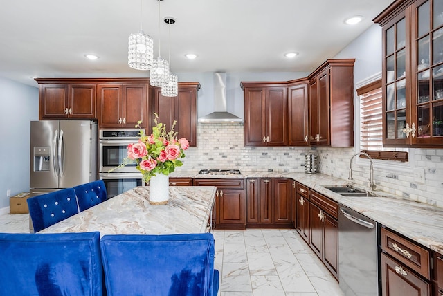 kitchen featuring a sink, marble finish floor, appliances with stainless steel finishes, wall chimney exhaust hood, and glass insert cabinets