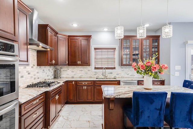 kitchen featuring glass insert cabinets, a kitchen breakfast bar, marble finish floor, stainless steel appliances, and a sink