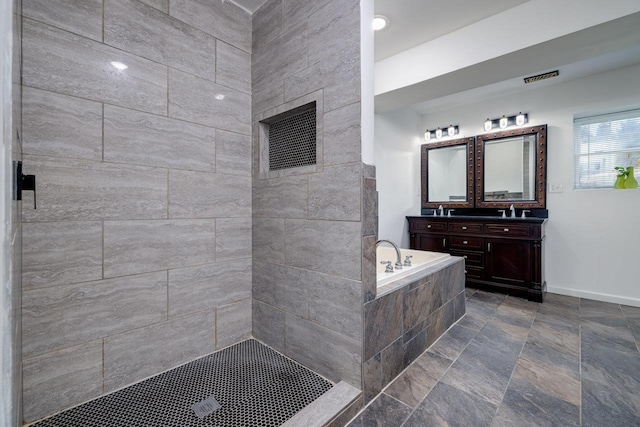 full bathroom with a garden tub, a sink, visible vents, baseboards, and double vanity