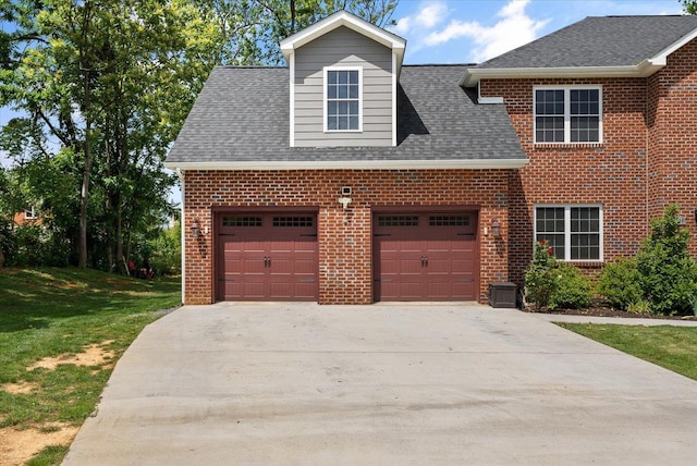 view of front of house with driveway, a shingled roof, an attached garage, and brick siding