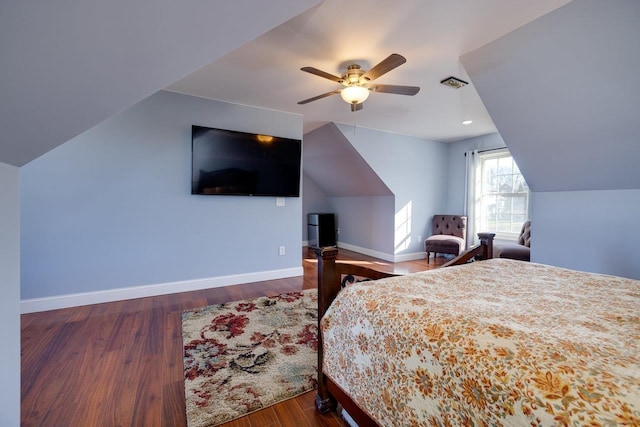 bedroom featuring visible vents, baseboards, dark wood finished floors, lofted ceiling, and ceiling fan