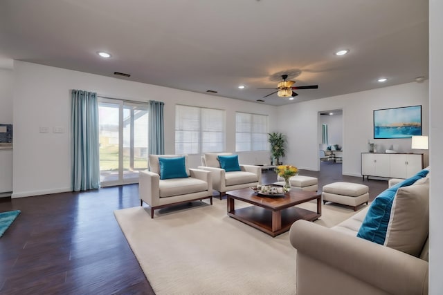 living area with ceiling fan, recessed lighting, wood finished floors, visible vents, and baseboards