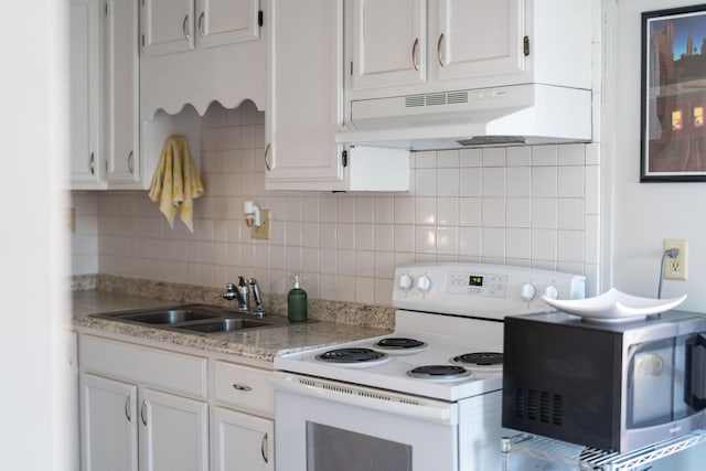 kitchen featuring white range with electric stovetop, light countertops, white cabinets, a sink, and under cabinet range hood