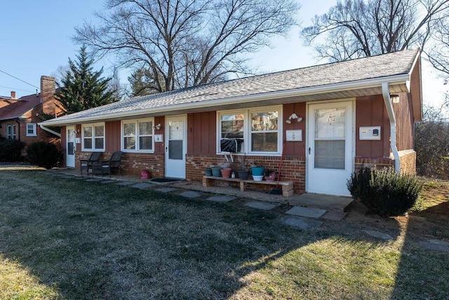 ranch-style home with a front lawn