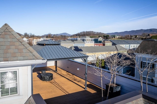 view of dock featuring a mountain view and a balcony