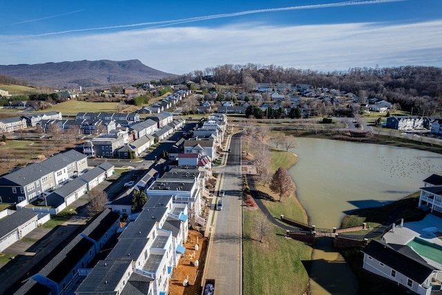 aerial view featuring a water and mountain view