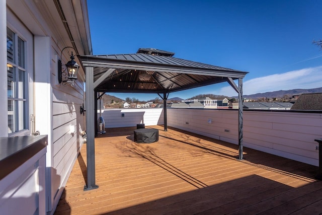 deck featuring a gazebo and a mountain view