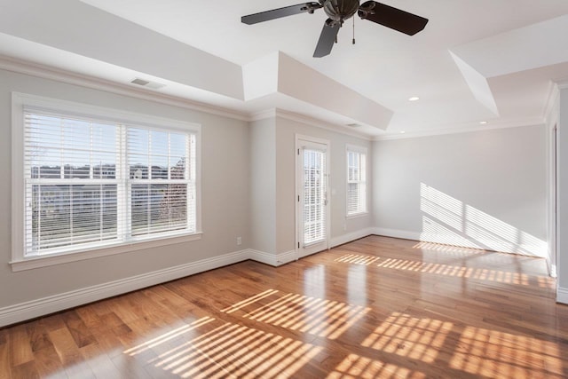 empty room featuring crown molding and light hardwood / wood-style flooring