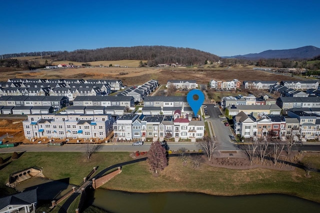 birds eye view of property featuring a mountain view