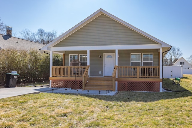 bungalow-style home with a porch and a front yard