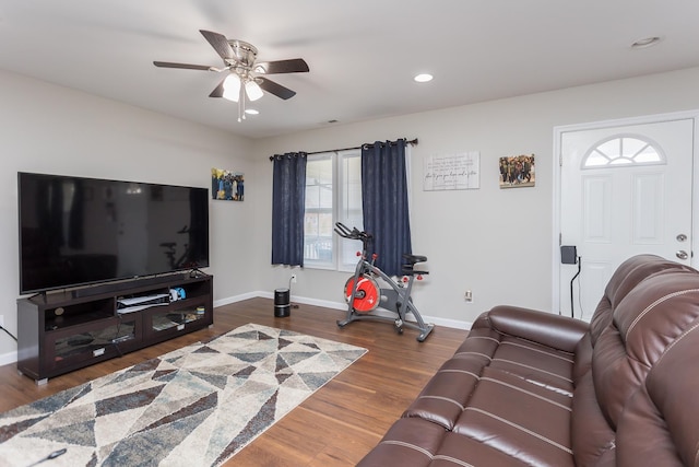 living area with recessed lighting, wood finished floors, baseboards, and ceiling fan