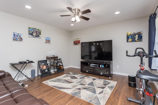 living room featuring recessed lighting, a ceiling fan, baseboards, and wood finished floors