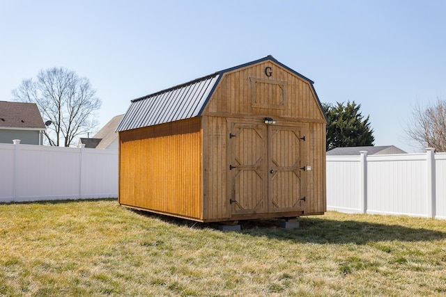 view of shed featuring a fenced backyard