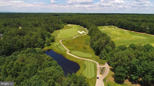 aerial view featuring a water view, a forest view, and golf course view