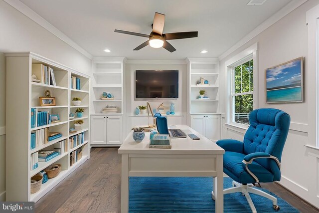 home office with crown molding, ceiling fan, and dark hardwood / wood-style flooring