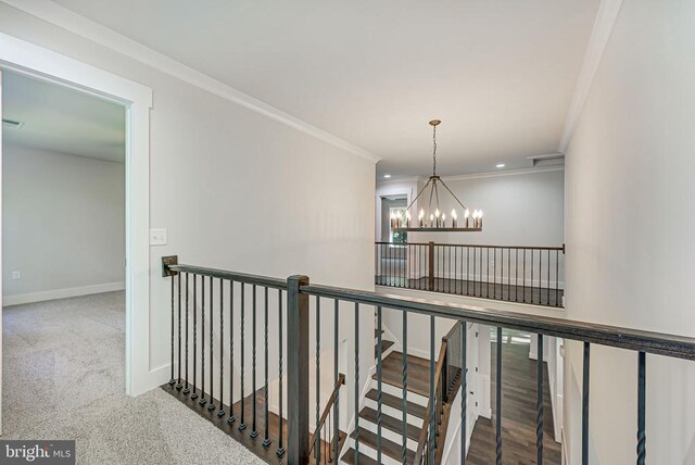 corridor featuring baseboards, crown molding, an upstairs landing, a notable chandelier, and recessed lighting