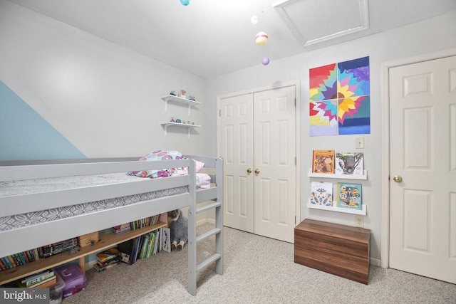 bedroom with a closet and attic access