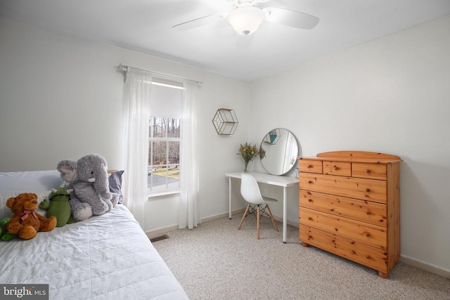 bedroom featuring a ceiling fan, carpet, visible vents, and baseboards