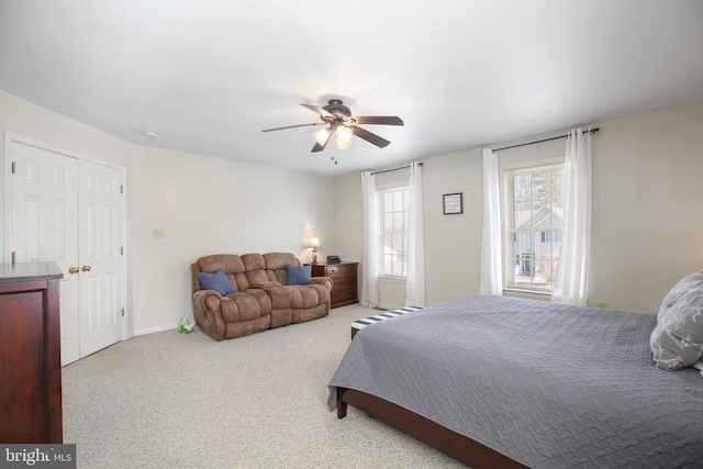 carpeted bedroom with ceiling fan