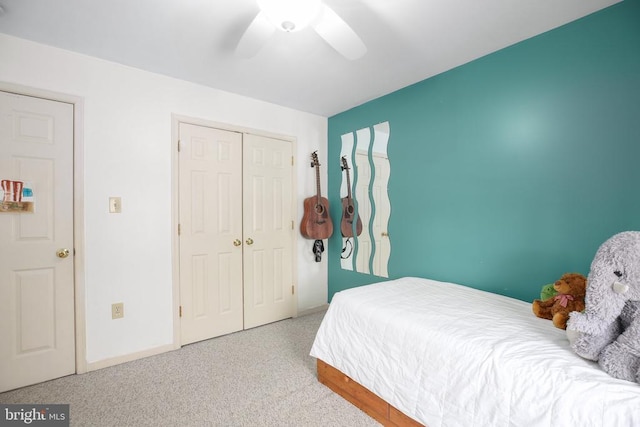 bedroom with a closet, baseboards, and ceiling fan