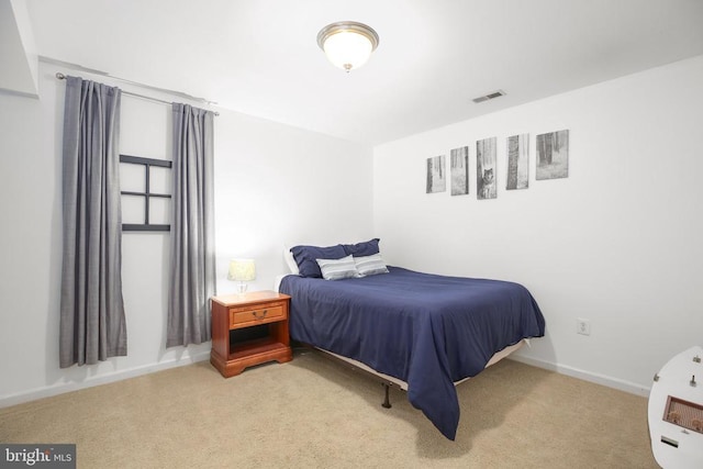 bedroom featuring carpet, visible vents, and baseboards