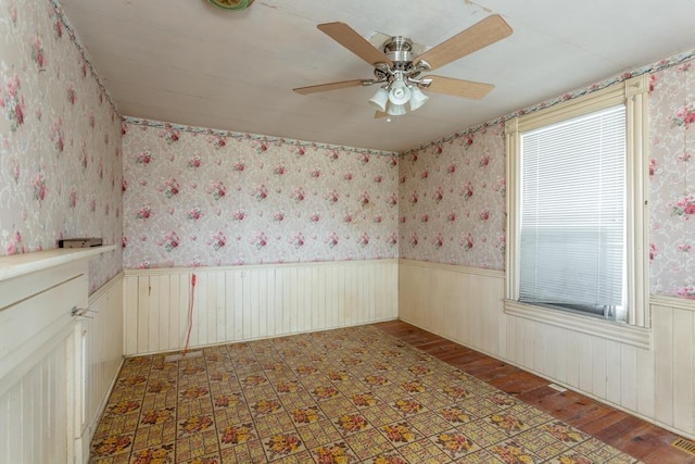 empty room with wood-type flooring and ceiling fan