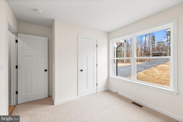 unfurnished bedroom featuring carpet floors