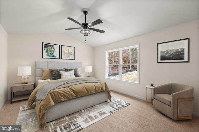 bedroom with ceiling fan, vaulted ceiling, and light carpet