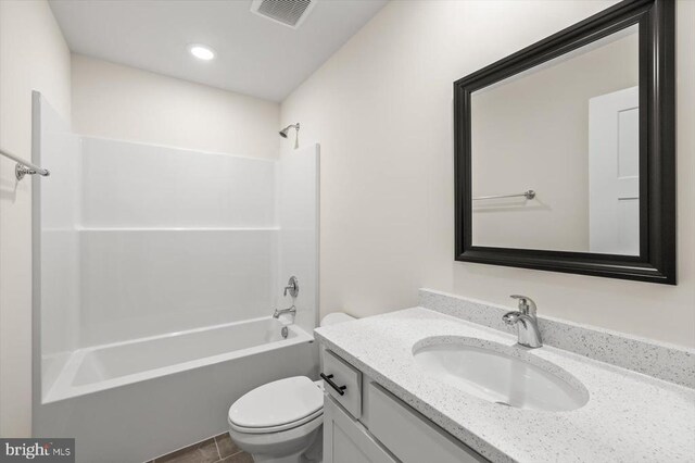 full bathroom featuring vanity, toilet, and bathing tub / shower combination