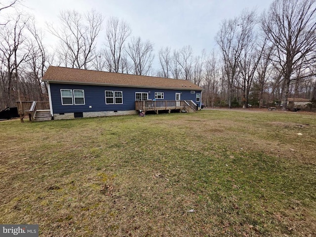 view of front of property with crawl space, a wooden deck, and a front lawn