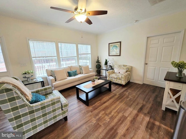 living room with dark wood finished floors, a textured ceiling, ceiling fan, and ornamental molding