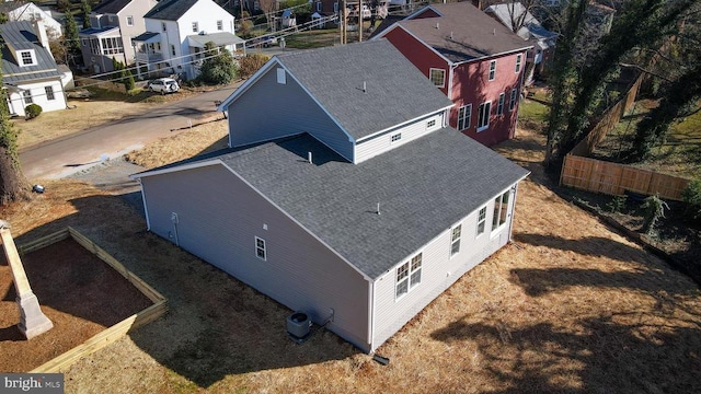 birds eye view of property with a residential view
