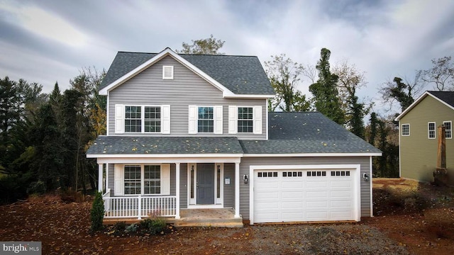 traditional-style home with a garage, roof with shingles, covered porch, and driveway