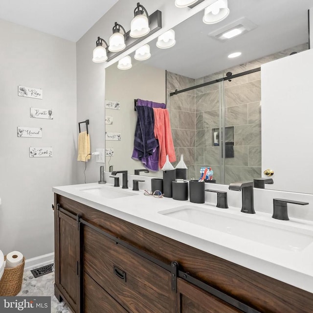 bathroom featuring vanity and a shower with shower door