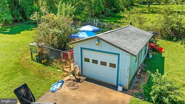 garage featuring a yard