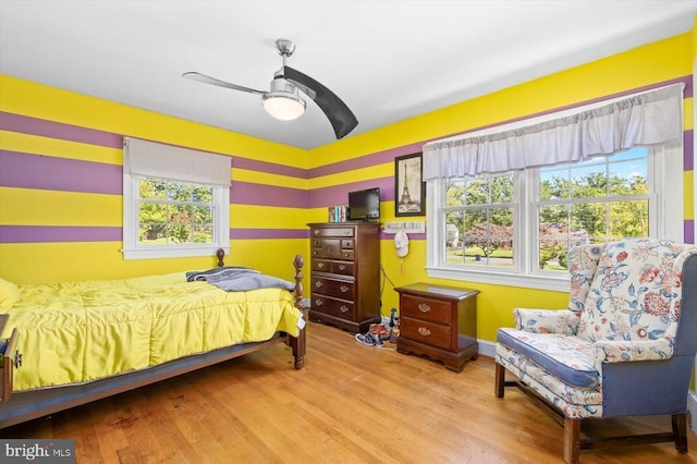 bedroom featuring ceiling fan and light wood-type flooring